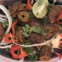 Seekh Kebab · Lean ground lamb delicately seasoned with herbs, spices and chopped onions.