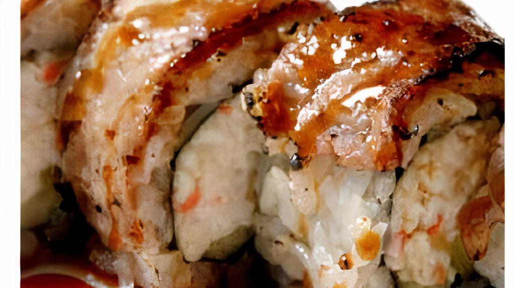 BBQ Roll · Deep-fried shrimp, crab, cucumber inside and topped with torched marinated teak, unagi sauce.