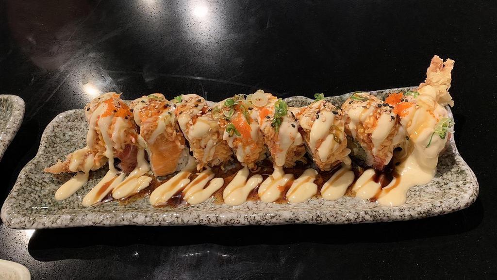 Titanic Roll · Shrimp tempura, cucumber, topped with salmon, tuna, spicy crab, and house unagi sauce.