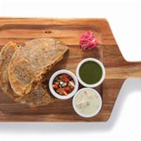 Quesadillix · Deep rooted in the streets of Punjab; whole wheat potato stuffed parantha flatbread, mozzare...