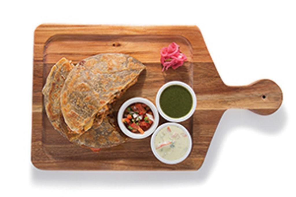 Quesadillix · Deep rooted in the streets of Punjab; whole wheat potato stuffed parantha flatbread, mozzarella, choice of protein, pickles, chaat masala yogurt and chutney