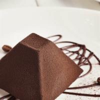Chocolate Truffle · Chocolate gelato, caramelized hazelnuts, and topped with cocoa powder.