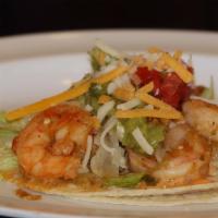 18. Baja Shrimp Taco · Chipotle mayonnaise, lettuce, pico de gallo, guac, and cheese.