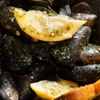 Moules Mariniere · Mussels steamed in white wine, garlic and herbs.