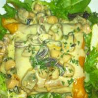 Seafood Vol-Au-Vent · Flaky pastry with baked seafood and mushrooms in a creamy sauce.