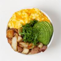Egg Breakfast Bowl · 2 Fried Eggs, Crispy Potatoes, Shredded Cheese, and Sliced Avocado over Arugula