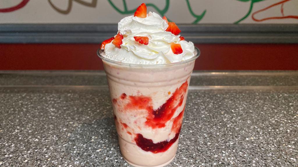 Strawberry Milkshake · Creamy strawberry milkshake, made with vanilla ice cream, milk, and fresh strawberries. Topped with sweet whipped cream!

Enjoy a fruity treat!