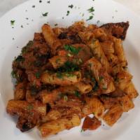 Rigatoni Boscaiola · Braised Meat, Porcini mushrooms & tomato sauce