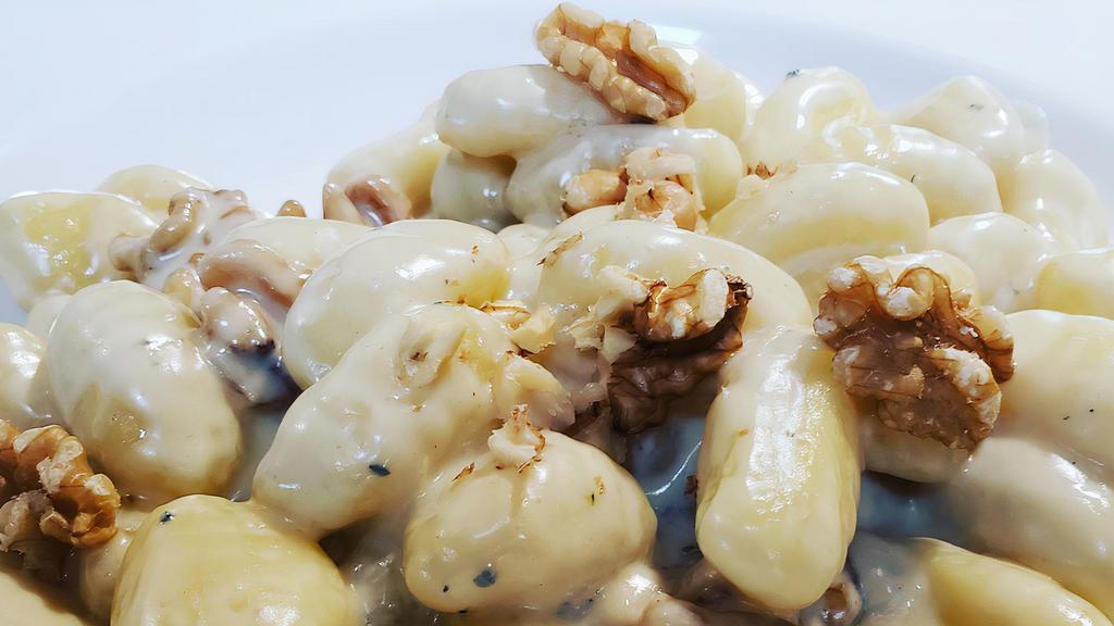 Gorgonzola Gnocchi · Topped w/ melted Gorgonzola cheese & walnuts ( In House - Hand Made Potato based pasta )