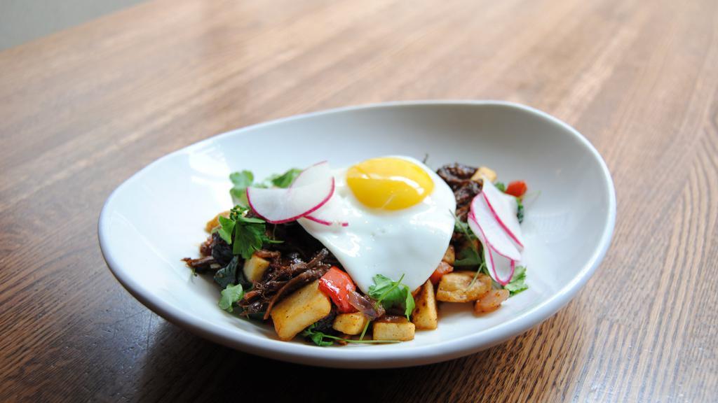 Short Rib Hash · Red wine braised short ribs, onions, bell peppers, garlic, bacon, and breakfast potatoes.  Served with sauteed spinach or sliced fruit and ACME toast with pepper jelly.  Topped with two eggs any style