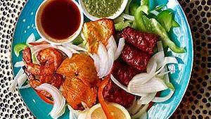 Assorted Tandoori Platter · Combination of chicken tikka, seekh keebab and tandoori prawn.