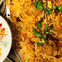 Lamb Biryani · Basmati rice from India cooked with saffron, herbs and served with raitha.