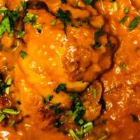 Fish Curry · Salmon cooked with onion, ginger, garlic, turmeric and other Indian spices