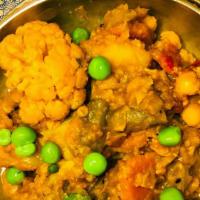 Spiced Vegetables Curry · Combination of cauliflower, beans, carrots, bell peppers, tomatoes and potatoes in a medium ...