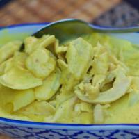 Yellow Curry Chicken · The most familiar of homemade Thai curries, chicken bathed in a golden coconut broth with on...