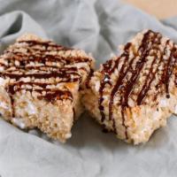 Rice Crispy Treats  · Rice Krispies and marshmallows, drizzled with homemade chocolate fudge sauce.