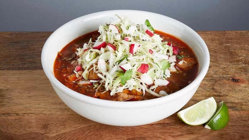 POZOLE :: · Pork and hominy stew. The savory broth gets its features from guajillo and ancho chiles. Served with cabbage, radish, onion, and oregano