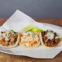STREET STYLE TACOS :: · Authentic Mexican tacos topped with cilantro & onions on small corn tortillas.(The veggie op...