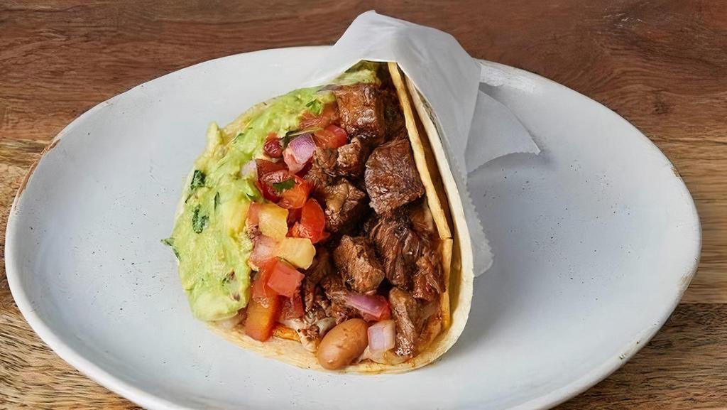 NICK'S WAY CARNE ASADA :: · One taco with a grilled crispy corn tortilla wrapped in a soft corn tortilla. With Jack cheese, pinto beans, pico de gallo, & guacamole
