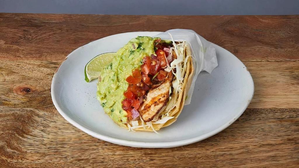 NICK'S WAY GRILLED FISH TACO :: · Marinated mahi-mahi in a crispy tortilla wrapped in a soft tortilla. With Jack cheese, guacamole, cilantro, cabbage, red onions, & tomatillo salsa
