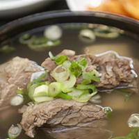 Beef Short Rib Stew / 갈비탕 · Beef short ribs with green onion, glass noodle in clear beef broth.