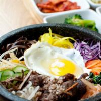 Hot Stone Bowl Bibimbop / 돌솥비빔밥 · A bed of bean sprouts, spinach, mushroom, zucchini and julienned carrots server over rice an...