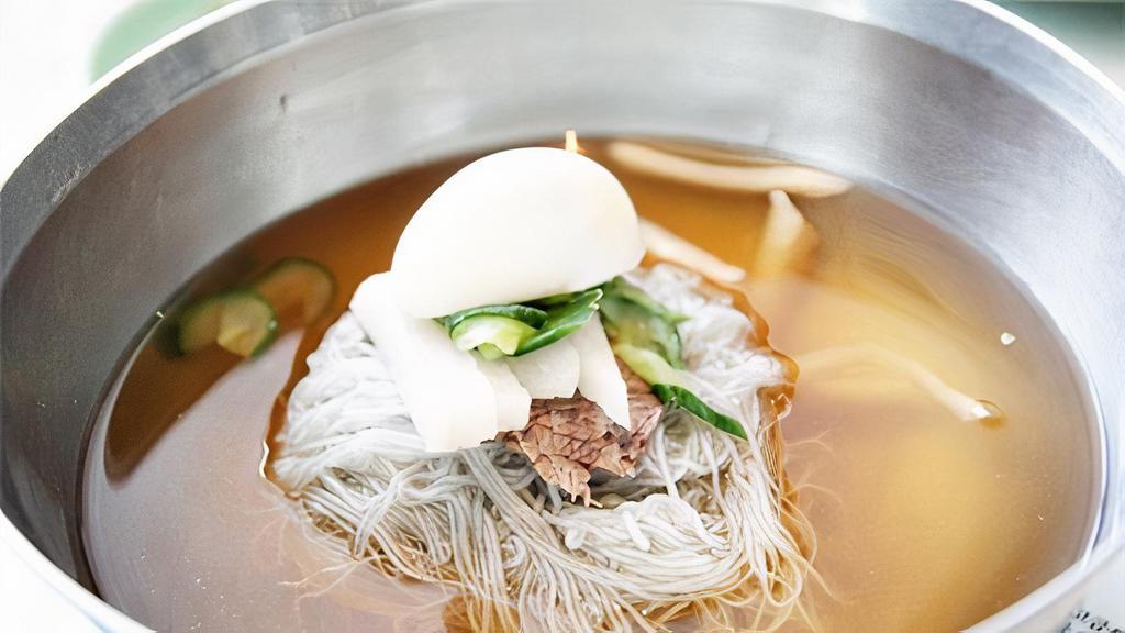 Mool Naeng Myeon / 물냉면 · Cold buckwheat noodle topped with sliced beef, radish, Korean pear, cucumber and boiled egg served in cold beef broth.