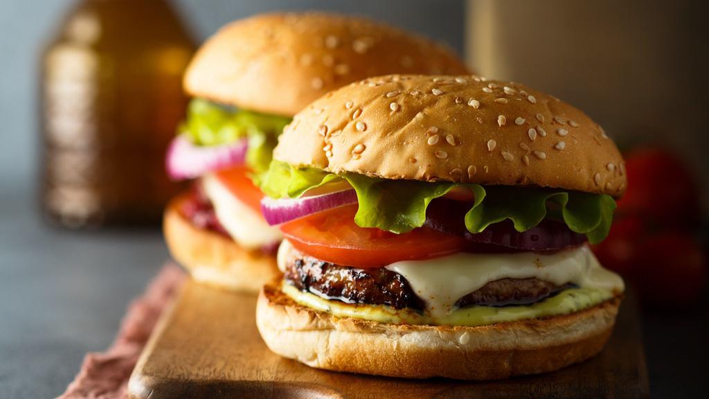 Lamb Burger · Lamb burger, cheese, onions, lettuce, tomatoes with garlic mayonnaise.