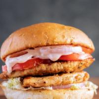 Ultimate Chicken Breast Sandwich · Grilled chicken breast, 2 crispy chicken tenders, tomatoes, onions, lettuce, del pickles, ch...
