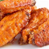 Buffalo Wings · Chicken wings Hot or BBQ, roasted in our stone fired ovens.