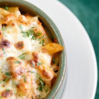 Villager Mac N Cheese · Penne pasta baked with special cheese sauce and house ingredients.