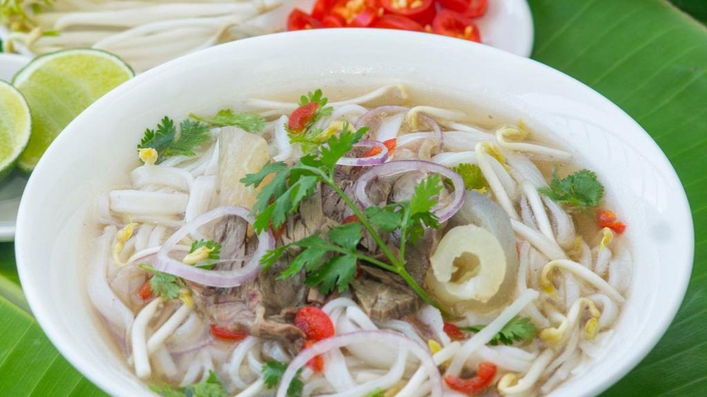 Pho Chicken Comfort · Gluten-free. Chicken bone broth, shredded all-natural white chicken breast and vegetables. Home-made, slow-cooked (10-hour!) bone broth served steamy hot in a big bowl with rice noodle, cilantro, basil, onions, lemon wedges, and bean sprout.