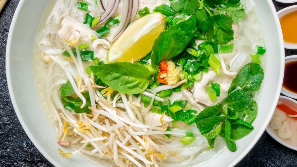 Pho Ga (Chicken) · Gluten-free. Chicken bone broth, shredded all-natural white chicken breast. Home-made, slow-cooked (10-hour!) bone broth served steamy hot in a big bowl with rice noodle, cilantro, basil, onions, lemon wedges, and bean sprout.