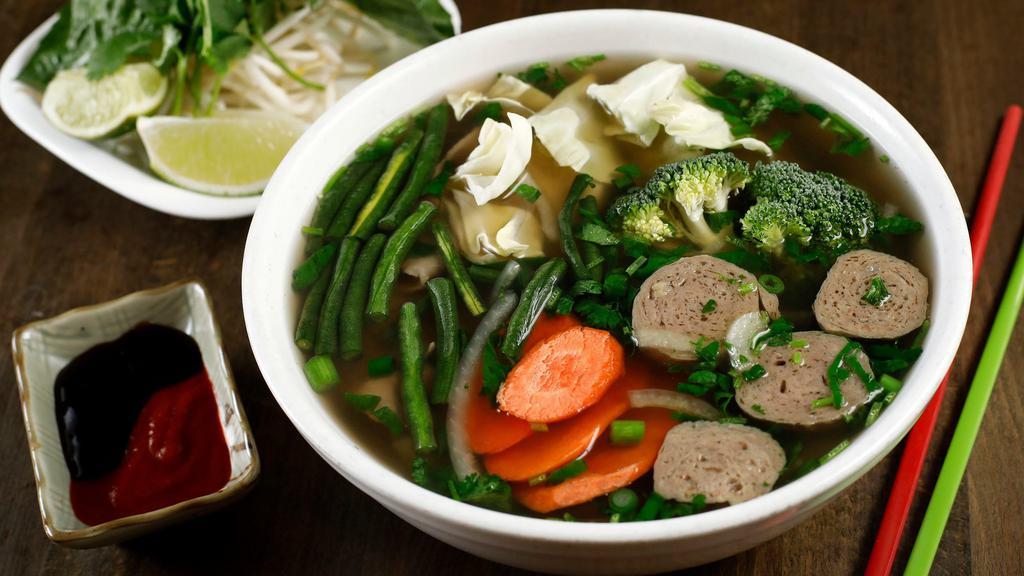 Pho Beef Comfort · Beef bone broth, black Angus rare steak, brisket, beef meatball, and vegetables. Home-made, slow-cooked (10-hour!) bone broth served steamy hot in a big bowl with rice noodle, cilantro, basil, onions, lemon wedges, and bean sprout.