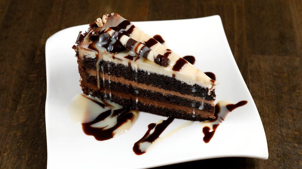 Tripple Chocolate Cake · Chocolate cake layered with milk, dark and ivory mousses.