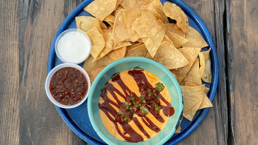 Queso Contigo · It's BACK!

The BackYard's house made Queso dip!

Smoked cheddar and gouda cheese dip, poblano & red bell pepper, onion, korean red chile and spices. Topped with chipotle sauce and pickled jalapeños. Served with crema, salsa and chips.