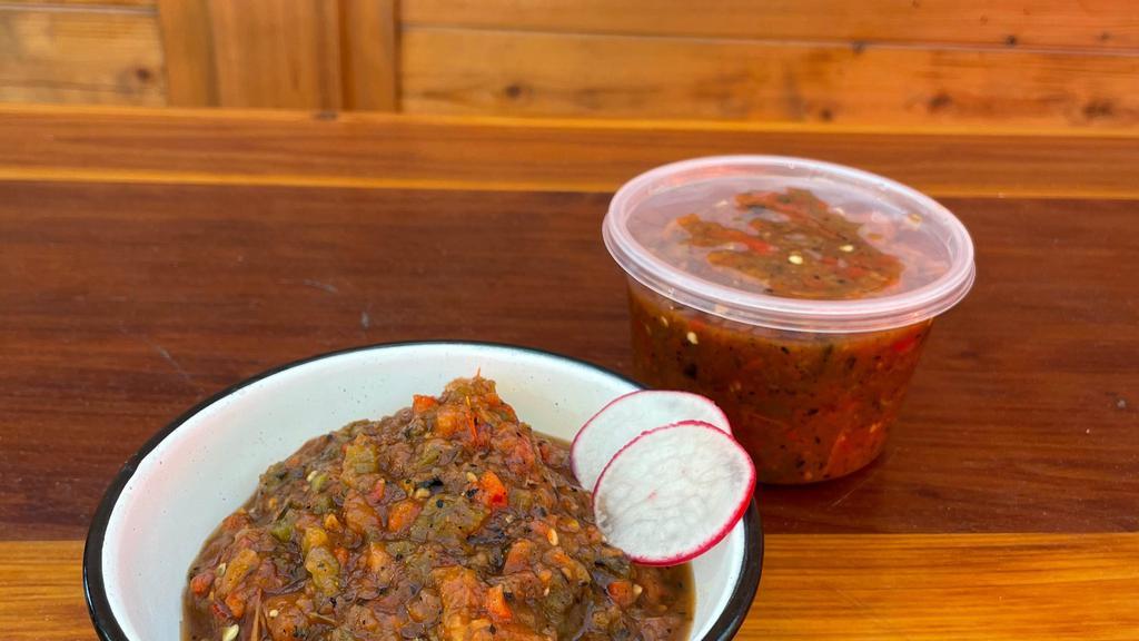 Salsa TO-GO! · Choose a pint of our house made salsas!

• Molcajete - roasted tomatillos, tomatoes, jalapenos, salt (mild heat)
• Oaxaqueno - roasted tomato, poblano peppers, bell peppers, oregano, lime, salt (medium heat)
•Cascabel - chile casabel, tomatillo, chile morita, garlic (medium heat)
• Quatro Chiles - chile de arbol, chile negro, chile ancho, chile pasilla, garlic, tomatillo (SPICY!)
