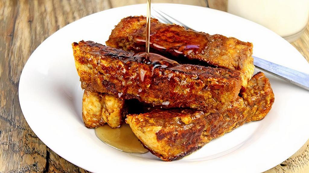 On the Run French Toast · Three pieces of French toast strips with a side of syrup.