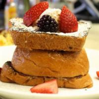 French Toast · dipped in cinnamon vanilla-cream batter and served with maple syrup topped with powdered sug...
