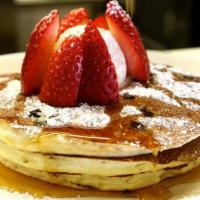 Buttermilk Pancakes · topped with powdered sugar and whipped honey cinnamon butter served with maple syrup.  Add b...