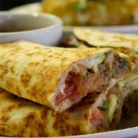 Chicken Quesadilla · House salsa, avocado and Mexican cheese blend.