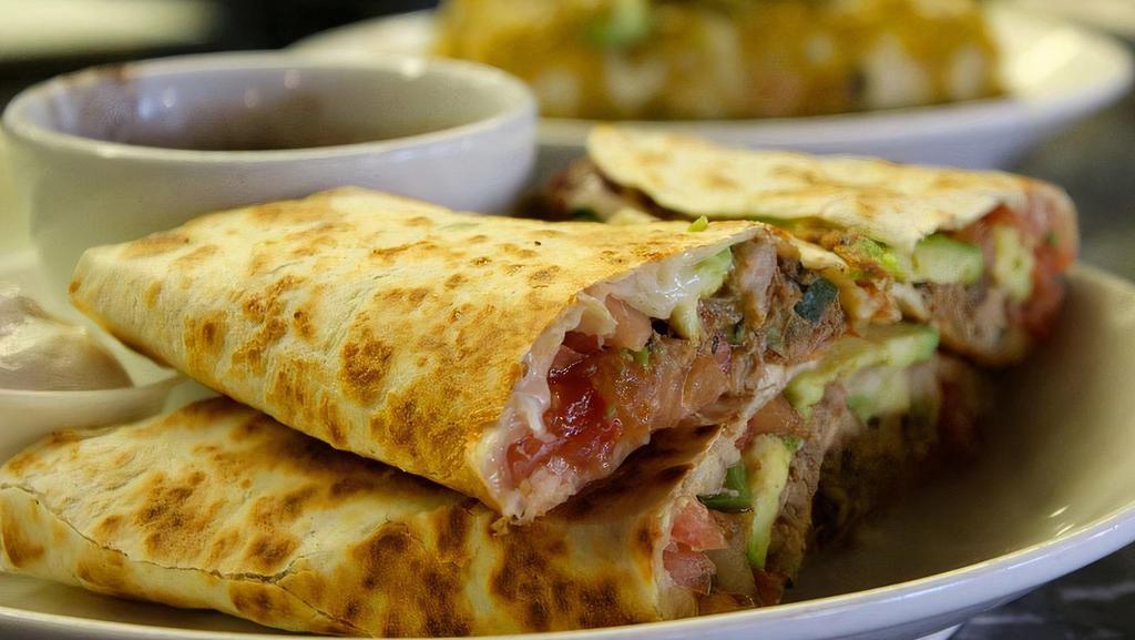 Chicken Quesadilla · House salsa, avocado and Mexican cheese blend.