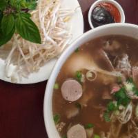 P20. Bac Lieu Pho Special · Includes rare beef,  brisket, flank, tendon, tripe, beefballs, and egg.