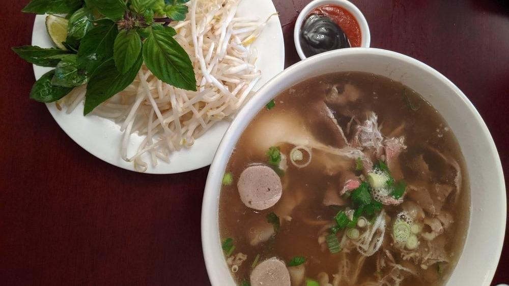 P20. Bac Lieu Pho Special · Includes rare beef,  brisket, flank, tendon, tripe, beefballs, and egg.
