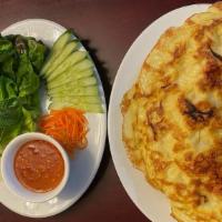 A13. Vietnamese Crepe · Bánh Xèo.  Savory crispy crepe filled with shrimp, pork, bean sprouts - served with side o...