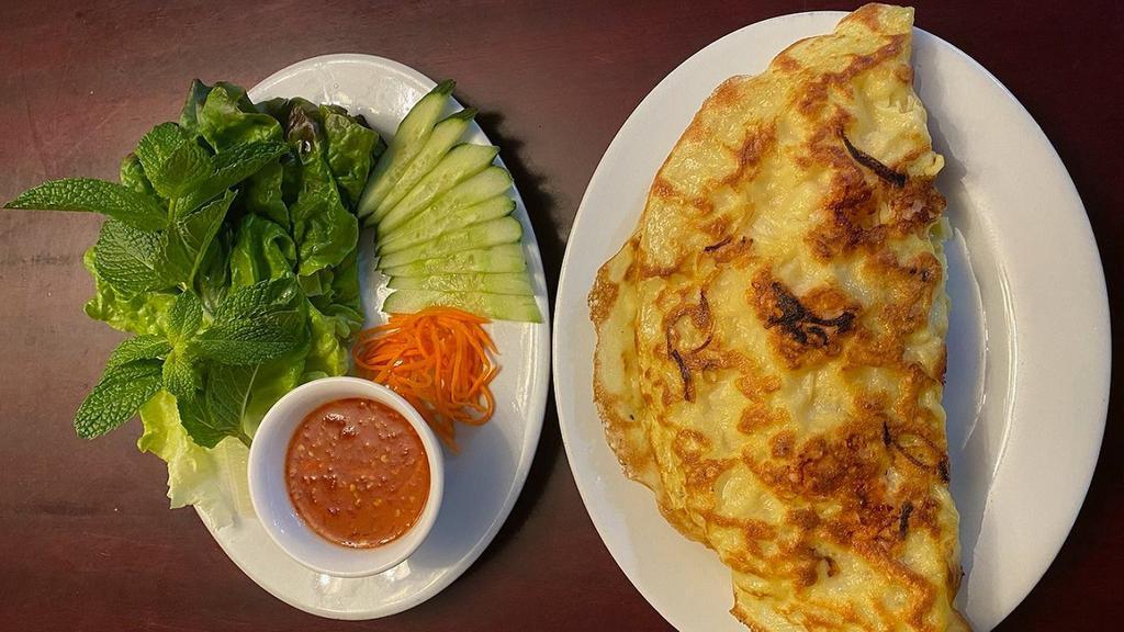 R9. Vietnamese Crepe · Savory crispy crepe filled with fried tofu bean sprout onion - served with fresh vegetables and soy dipping sauce.