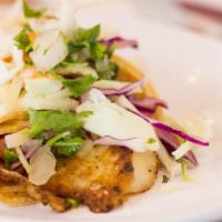 Fish Taco · Grilled tilapia, salsa ranchera, cabbage & chipotle sauce.