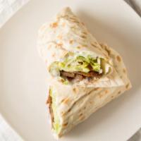 Lamb & Beef · Thin slices of marinated lamb & beef with tzatziki sauce, lettuce, tomato, cucumbers.