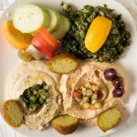 2. Dip Platter · Hummus, babaghanoush, olives, feta, 2 falafel, tomato, cucumbers, pickle slice orange taboul...