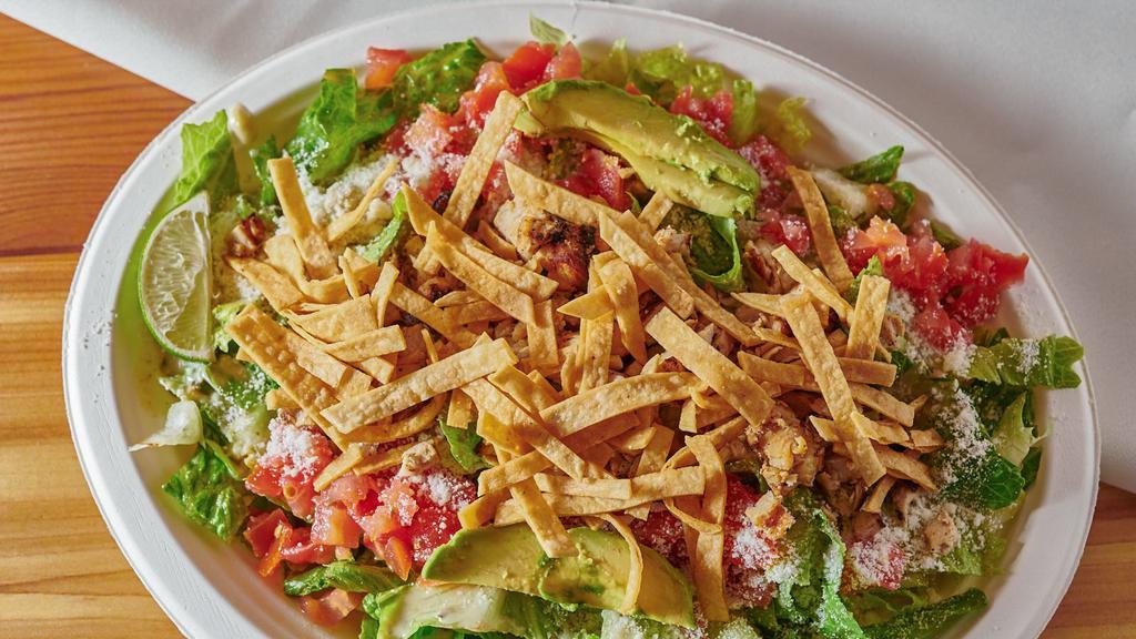 Chile Lime Salad · Chicken, steak or carnitas, romaine lettuce, cotija cheese, tomatoes and avocado topped with chile lime dressing and tortilla strips.